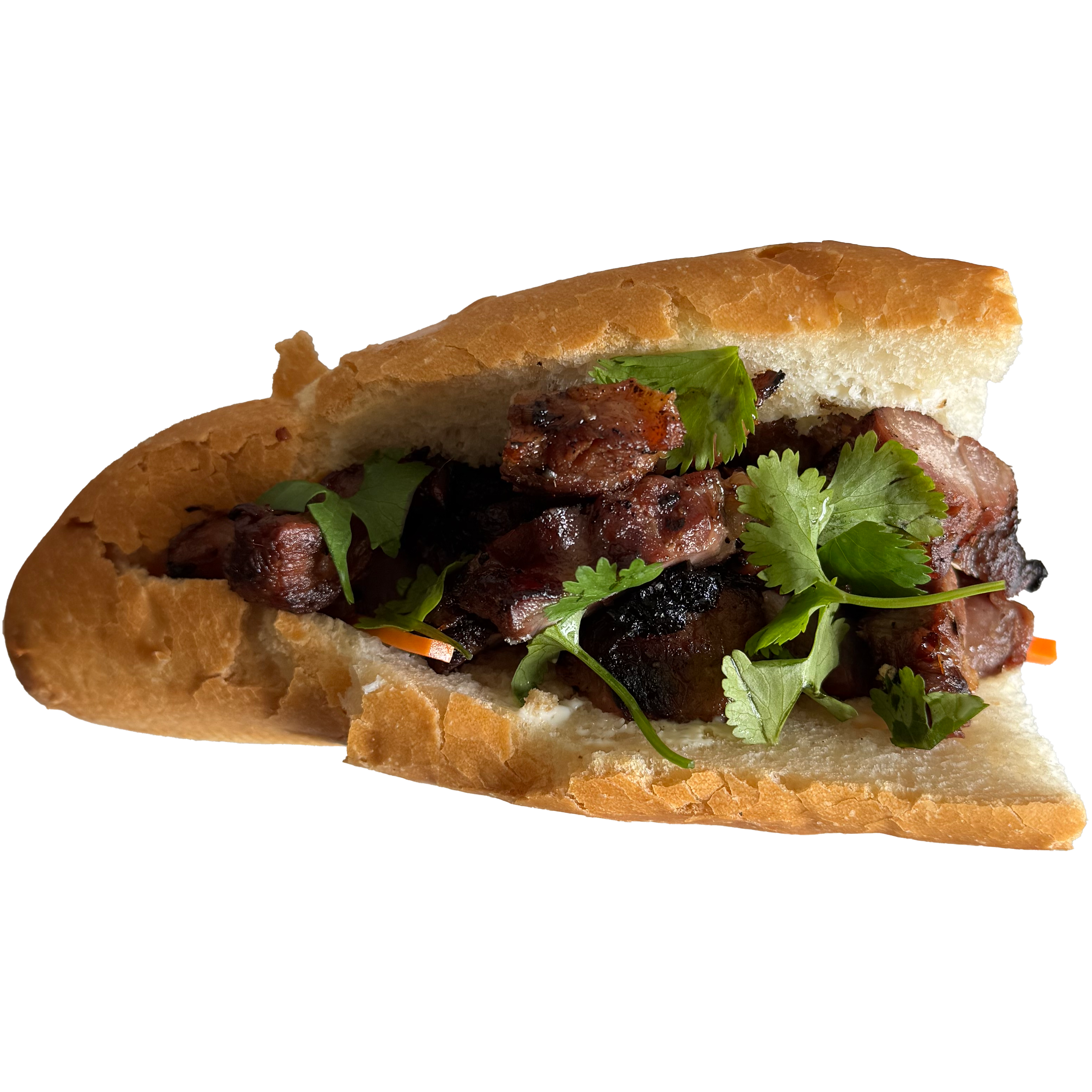 A photo of a homemade banh mi sandwich with grilled pork and cilantro in a sliced baguette