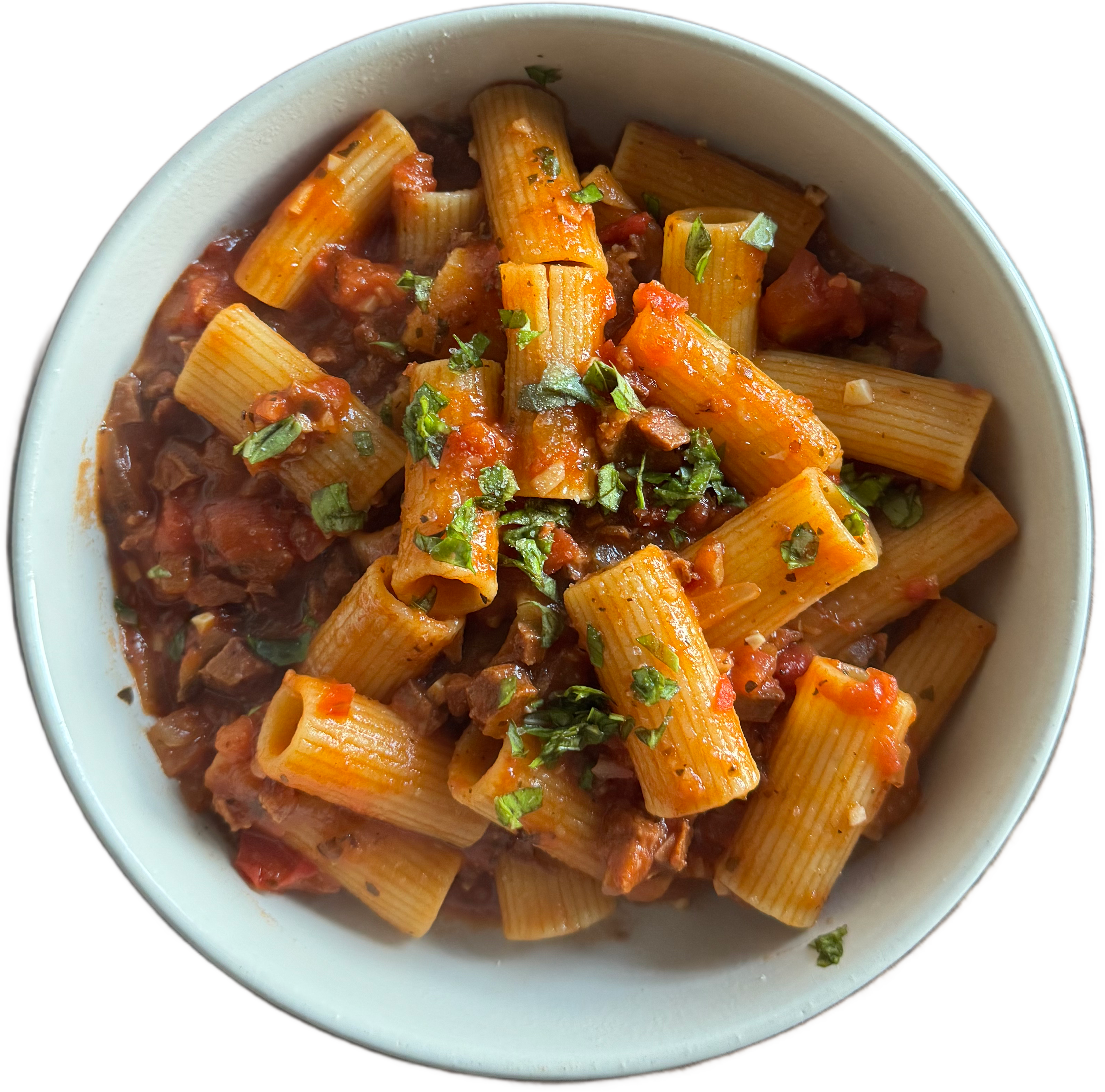 A bowl of rigatoni pasta with ammatriciana sauce