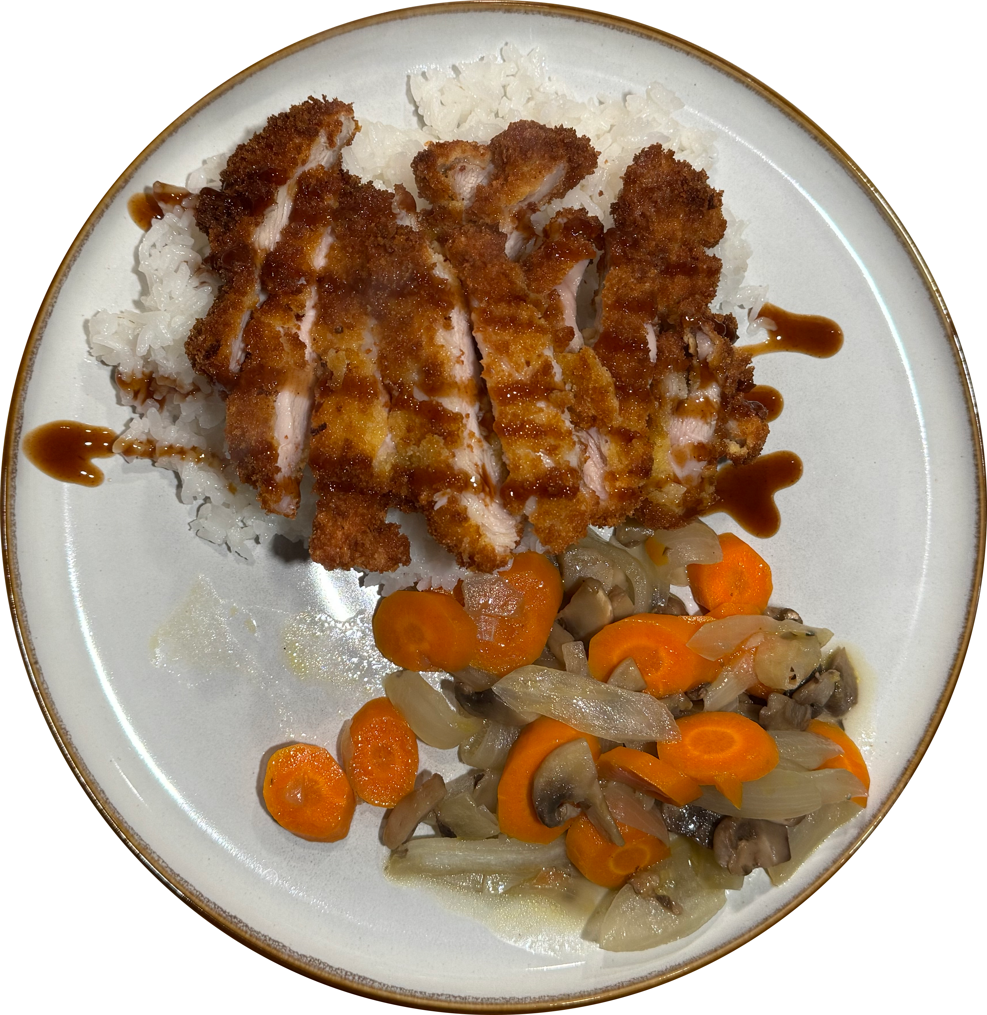 A plate of chicken katsu drizzled with katsu sauce served alongside sauteed onions, carrots and mushrooms